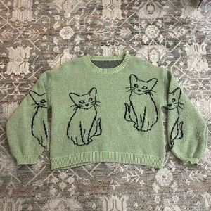 Green cat sweater